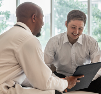 Younger man talking with his doctor